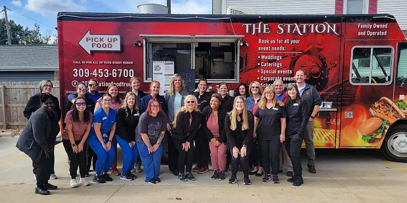 Team photo standing in front of a Food Truck