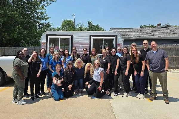 Team photo standing in front of an ice cream truck